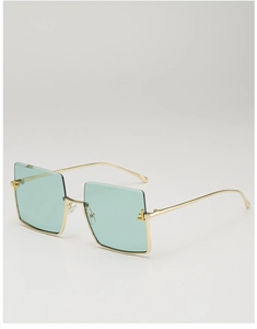 Detail of oversized square sunglasses with gold metal frame and mint green lenses