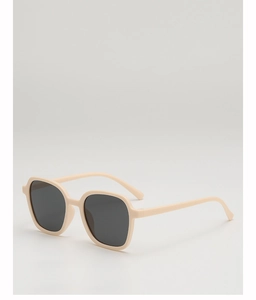 Detail view of cream-colored square frames and protective dark lenses on kids sunglasses