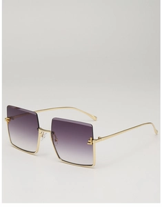 Detail of gradient purple lenses and gold metal frame with geometric temple ornaments