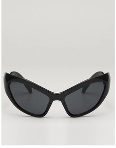 Close-up of black cat-eye sunglasses with unique batwing-style frame and dark gray lenses
