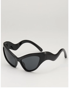 Detail of trendy black cat eye sunglasses featuring unique wavy textured temple design