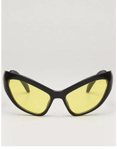 Detailed view of cat-eye sunglasses featuring black frames and yellow tinted lenses