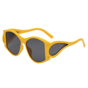 Oversized punk style sunglasses in bright yellow with dark grey lenses and wing decor