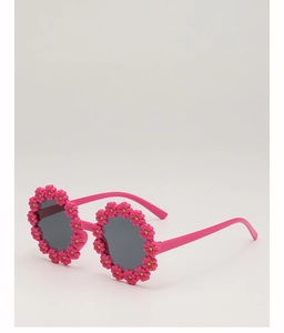 Detail view of pink floral baby sunglasses with daisy frame and grey lenses
