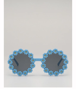 Close-up of blue flower-shaped children's sunglasses with yellow floral centers