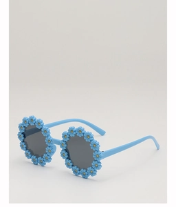 Detailed view of sky blue flower-shaped sunglasses frame with dark round lenses