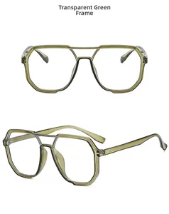 Detail of transparent green polygon frame glasses with double bridge design and large lenses