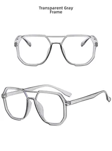 Detail view of transparent gray polygon glasses frames featuring a modern double bridge design