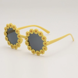 Fashionable flower-shaped sunglasses for kids with yellow daisy frames and dark lenses