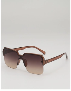 Detail of semi-rimless square sunglasses with amber geometric frames and gradient lenses