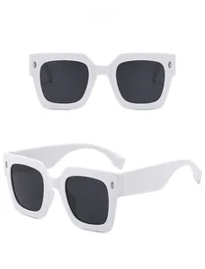 Front and side view of white square sunglasses with silver accents and gray lenses