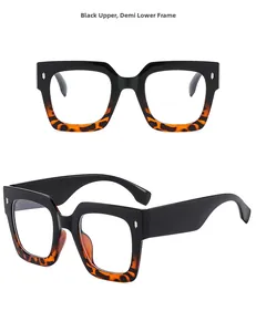 Detail of square glasses with black and tortoise frame and clear lenses for a retro look