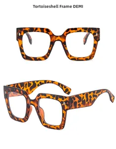 Detail view of large square demi-tortoise eyeglass frames with wide temple design