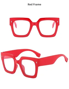Detail view of bold red square frames with clear lenses for a trendy fashion look