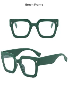 Detail view of bold green square frame sunglasses with silver rivet accents and clear lenses