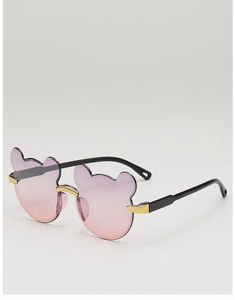 Detail view of bear-shaped sunglasses with purple pink gradient lenses and gold bridge