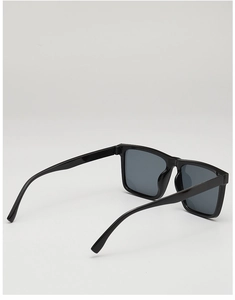 Detail view of the sleek black frame and temple curvature of vintage square sunglasses
