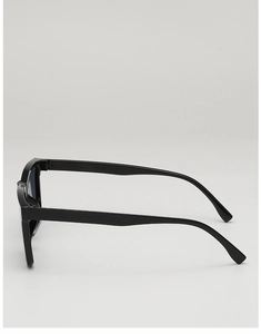 Side view of sleek black retro oval sunglasses with high-gloss finish and curved temples