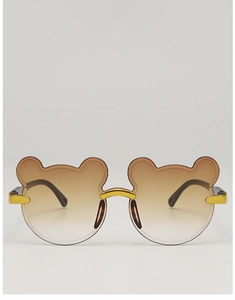 Close-up of cute bear-shaped kids sunglasses with brown gradient lenses and gold metal accents