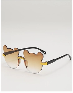 Close-up of bear-shaped gradient lenses with elegant gold metal bridge for kids sunglasses