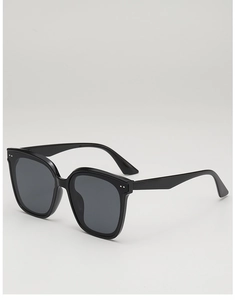 Detail of square black sunglasses with dual silver metal rivets on the polished frame