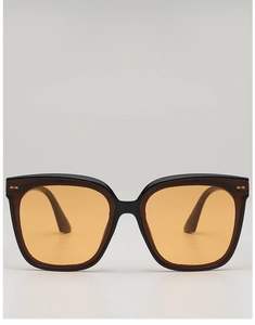 Front view of square fashion sunglasses with black frame and orange lenses and metal studs