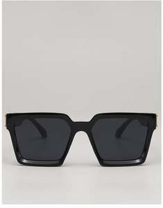 Detailed close-up of stylish square black sunglasses with gold metal temple hinges