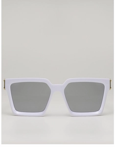 Detail of white square frame sunglasses featuring golden hinges and gray lenses