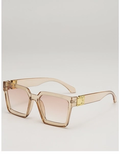 Detail of square sunglasses with champagne frames, gradient lenses and metal rivet hinges