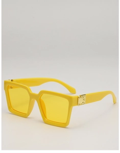Detail of yellow square sunglasses frame with golden metal hinge buckle and rivet design