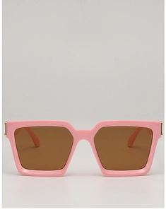 Close-up of pink rectangular frames with amber lenses and golden metal side details