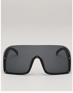 Front view of semi-rimless sunglasses with dark lenses and silver metal rivet details