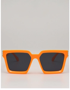 Detailed close-up of glossy orange square frame sunglasses with dark grey lenses