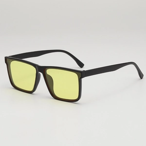 Vintage square black sunglasses with yellow lenses, stylish eyewear for beach and travel