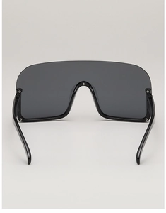 Detail view of large shield sunglasses featuring premium black frame and metal hinges