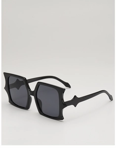 Side view of black gothic butterfly sunglasses with star-shaped pointed frame detail