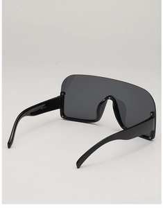 Detail shot of oversized semi-rimless sunglasses showing model PCP 0210 on the inner temple
