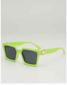 Detail of trendy green square sunglasses showing the gold metal hinge and polished texture