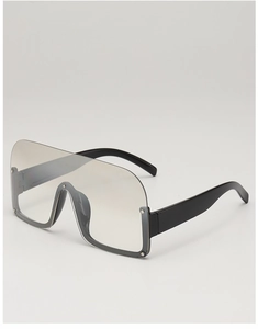 Close-up of semi-rimless sunglasses with gradient lenses and silver rivet details