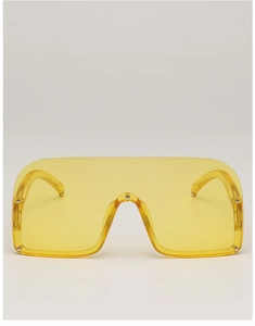 Detailed view of yellow one-piece lens sunglasses featuring silver stud embellishments