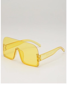 Detail view of bright yellow wrap-around sunglasses showing specs on inner temple