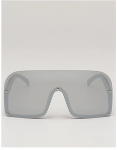 Detailed view of silver shield sunglasses with futuristic metallic studded accents