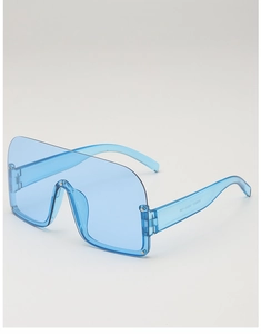 Detail view of transparent blue semi-rimless sunglasses with monolithic lens and PC frame