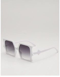 Detail of white butterfly sunglasses frame featuring unique star-shaped corner accents