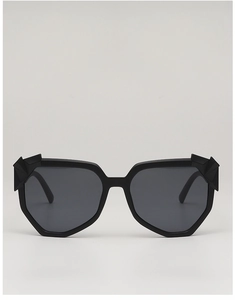 Detailed front view of black geometric sunglasses with unique textured frame details