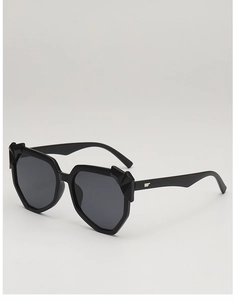Close-up of black irregular frame sunglasses with 3D geometric crystal decor and logo