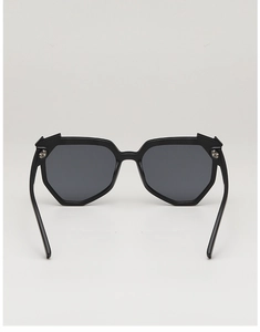 Macro detail of fashionable black geometric oversized sunglasses with dark lenses