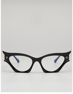 Detail of cat-eye frames with golden eye-shaped accents and sleek blue temple tips