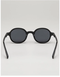 Front view of classic oval black frame sunglasses with dark gray UV lenses on gray backdrop