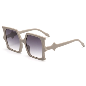 Futuristic oversized butterfly sunglasses with star-shaped matte frames and gradient lenses